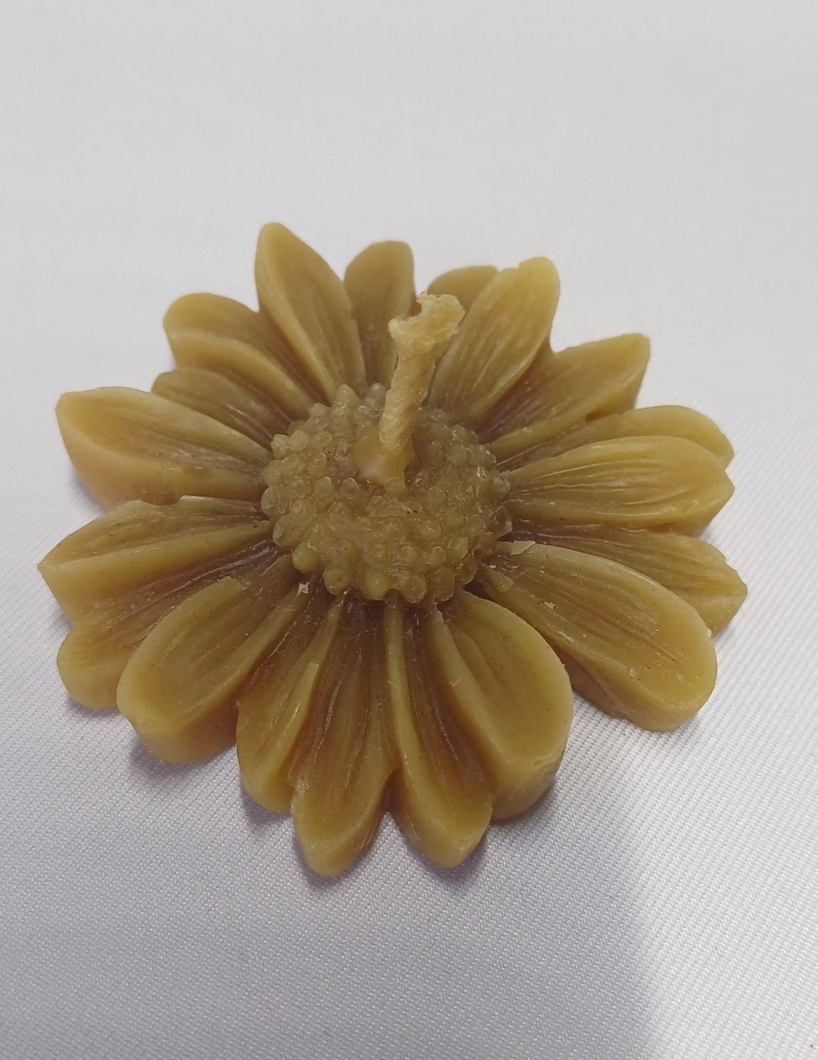 Vela con forma de margarita